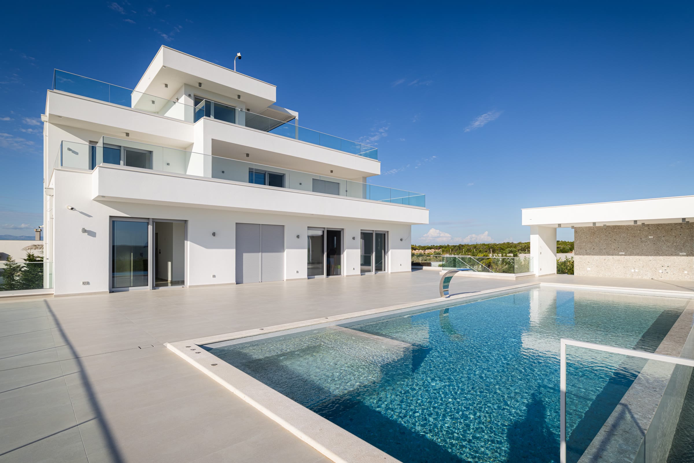 The villa's four levels seen from the front on a clear day